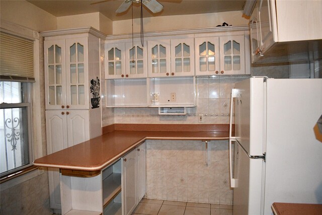 139-15 89th Ave, Briarwood, NY 11435 - kitchen featuring glass insert cabinets, white cabinetry, freestanding refrigerator, and ceiling fan