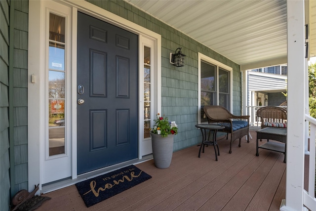 doorway to property featuring covered porch