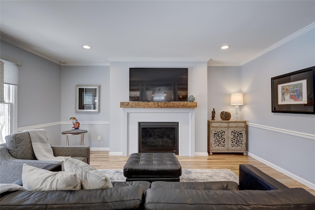 living area with wood finished floors, recessed lighting, and ornamental molding