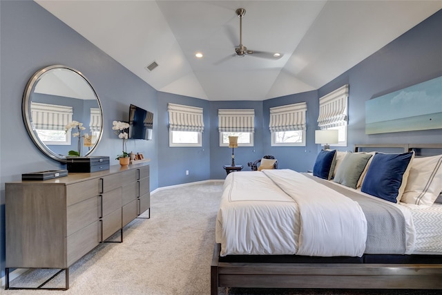 bedroom with light carpet, vaulted ceiling, visible vents, and baseboards
