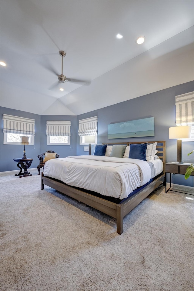 carpeted bedroom with lofted ceiling, a ceiling fan, baseboards, and recessed lighting