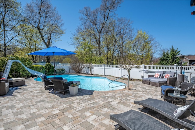 view of pool featuring a fenced backyard, outdoor lounge area, and a patio
