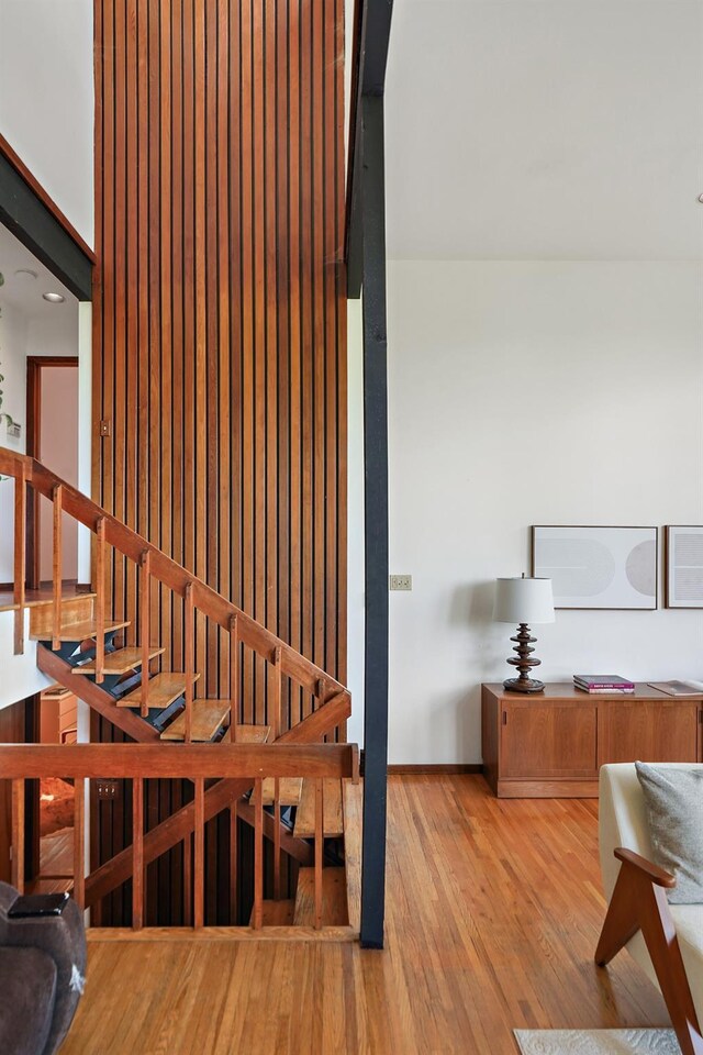 interior space with baseboards and wood finished floors