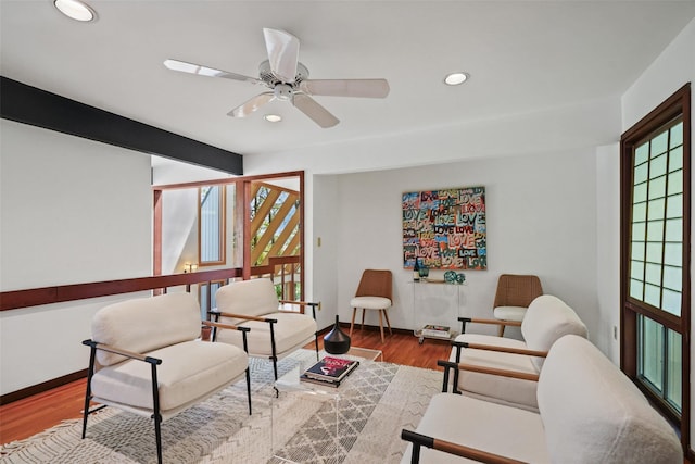 sitting room with baseboards, a ceiling fan, recessed lighting, and wood finished floors