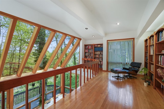 living area with wood-type flooring, recessed lighting, and lofted ceiling