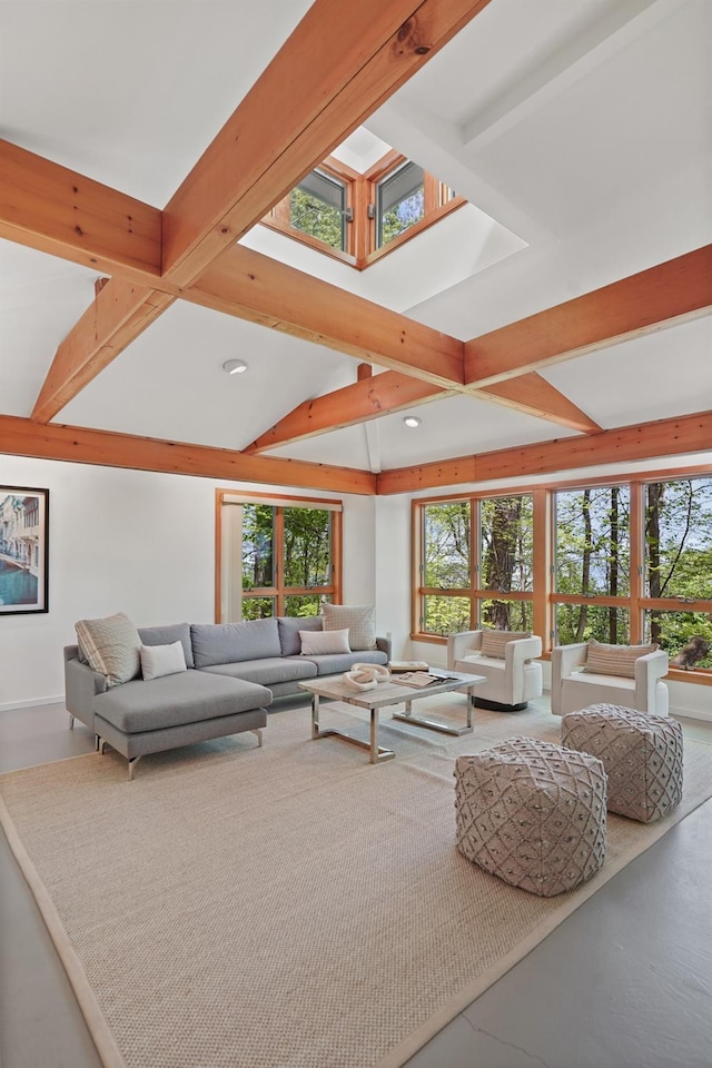 living room with recessed lighting, a healthy amount of sunlight, a skylight, and beamed ceiling