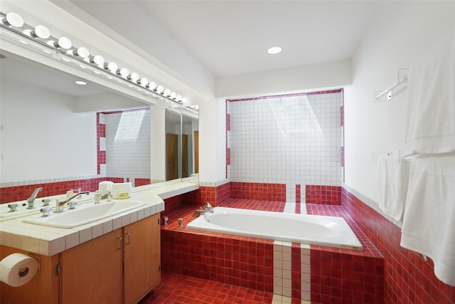 full bathroom featuring vanity and a bath