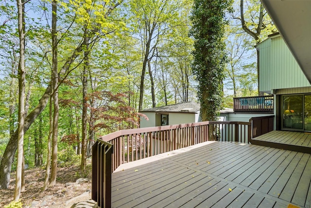 wooden deck with an outbuilding