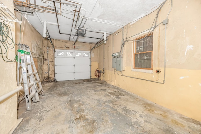 garage featuring a garage door opener and electric panel