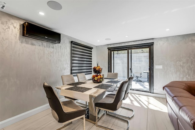 dining area with baseboards, wood finished floors, recessed lighting, and a wall mounted air conditioner