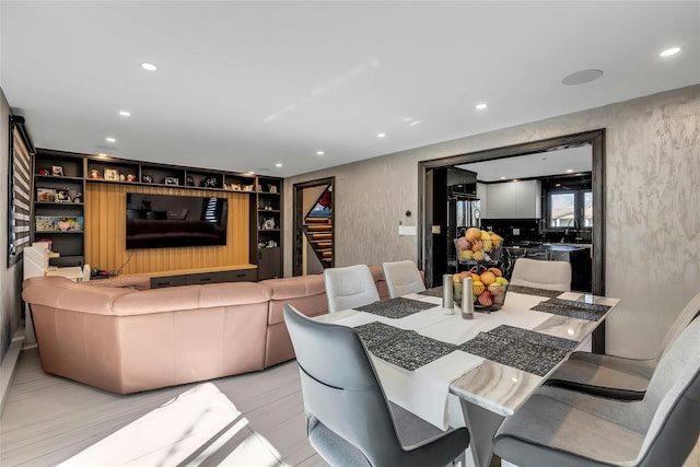 dining area featuring recessed lighting and built in shelves