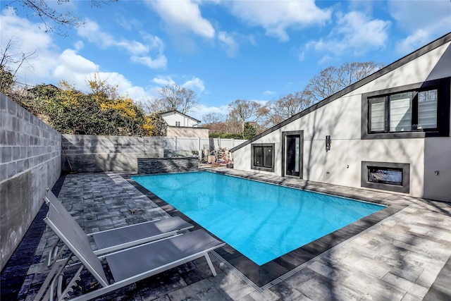 view of pool featuring a fenced in pool, a patio, and a fenced backyard