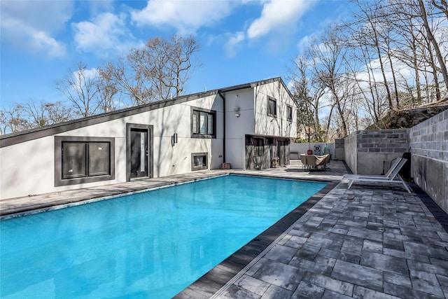 view of pool featuring a fenced in pool, a patio area, and fence