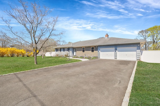 single story home with a chimney, aphalt driveway, fence, a front lawn, and a garage