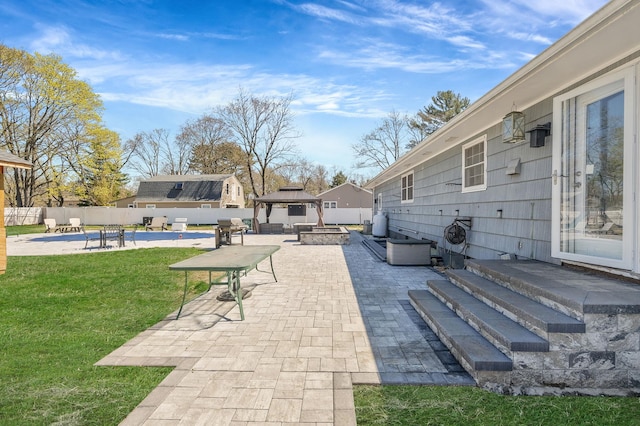 view of patio with a fenced in pool, area for grilling, a fenced backyard, a fire pit, and a gazebo