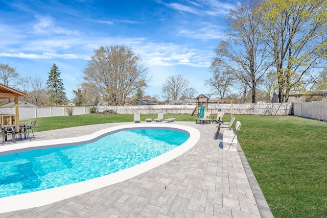 view of pool with a lawn, a fenced backyard, a fenced in pool, and a playground