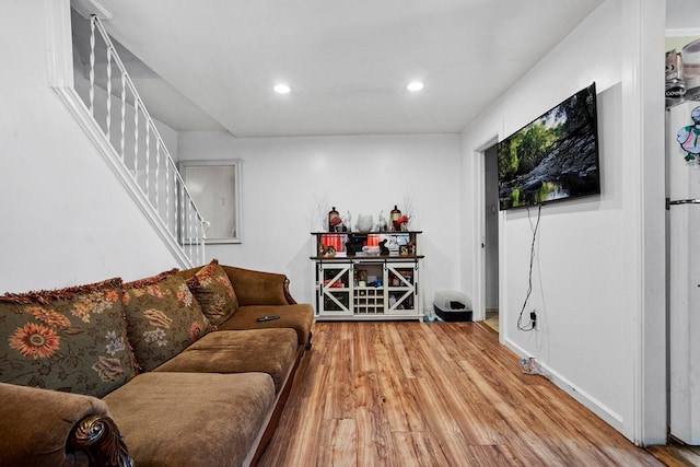 107-50 90th St, Ozone Park, NY 11417 - living room with wood finished floors, recessed lighting, and stairs