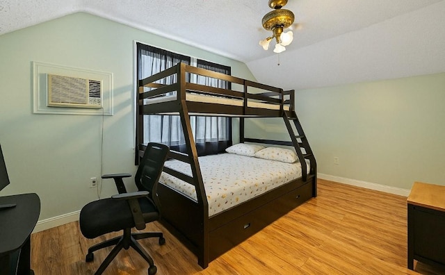 107-50 90th St, Ozone Park, NY 11417 - bedroom featuring baseboards, wood finished floors, and lofted ceiling