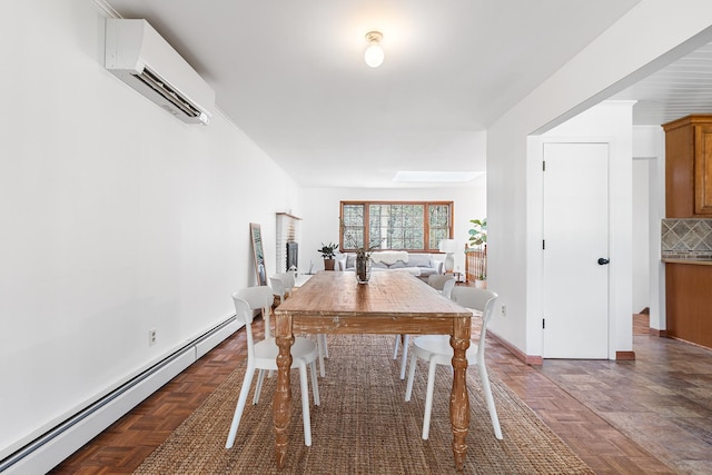dining room with baseboard heating, an AC wall unit, and baseboards