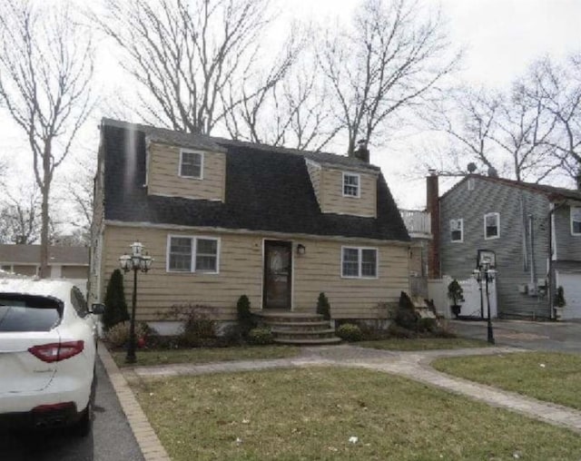 view of front of house featuring a chimney