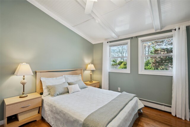 bedroom with vaulted ceiling with beams, wood finished floors, and a baseboard radiator