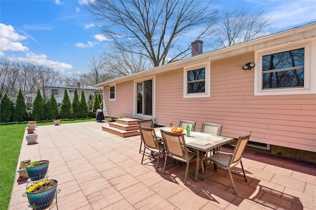 view of patio featuring outdoor dining area