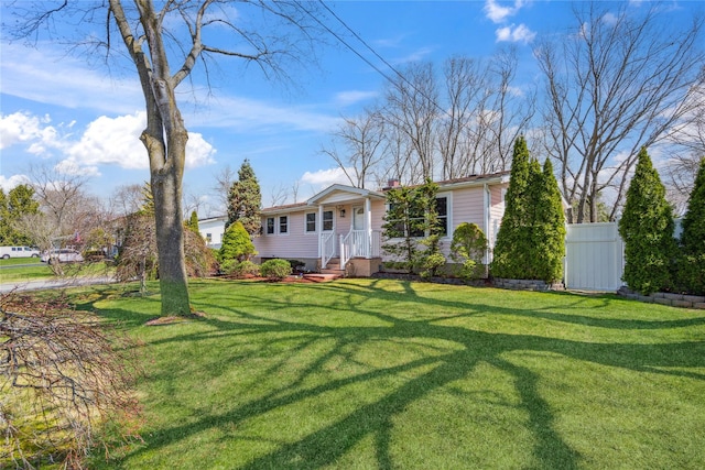 single story home with a chimney, fence, and a front yard