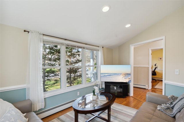 living room featuring recessed lighting, a baseboard heating unit, and vaulted ceiling