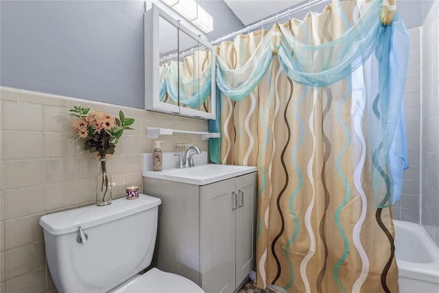full bathroom with shower / bathtub combination with curtain, vanity, tile walls, and toilet