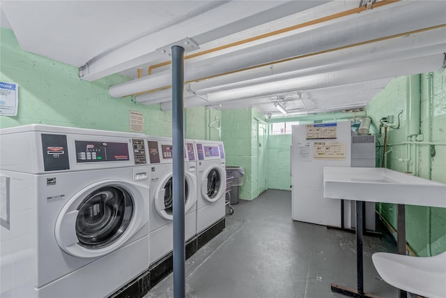 shared laundry area with independent washer and dryer
