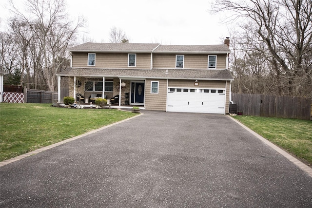 view of front facade featuring a chimney, aphalt driveway, fence, a porch, and a garage