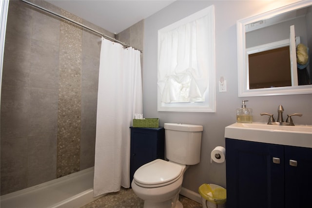 full bath with vanity, a shower stall, and toilet