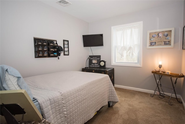 bedroom with visible vents, carpet flooring, and baseboards