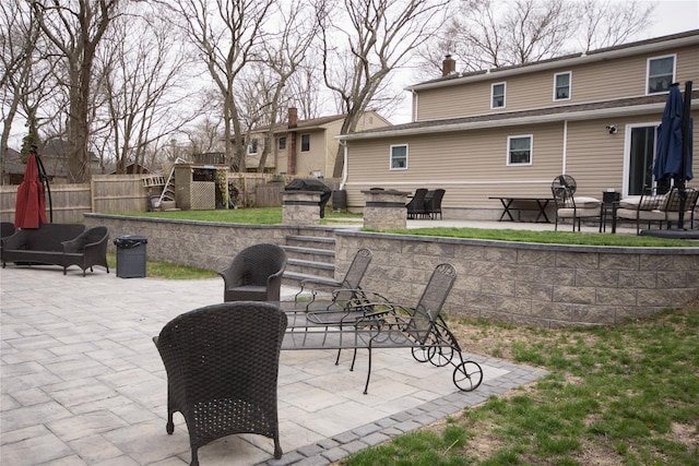 view of patio featuring fence
