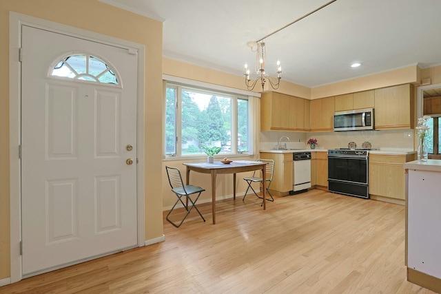 120 Locust Dr, Nyack, NY 10960 - kitchen with stainless steel microwave, gas stove, dishwasher, light brown cabinetry, and light countertops