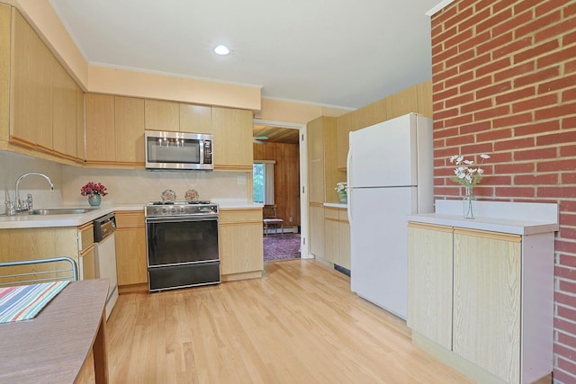 120 Locust Dr, Nyack, NY 10960 - kitchen with white appliances, a sink, light brown cabinets, light wood-style floors, and light countertops