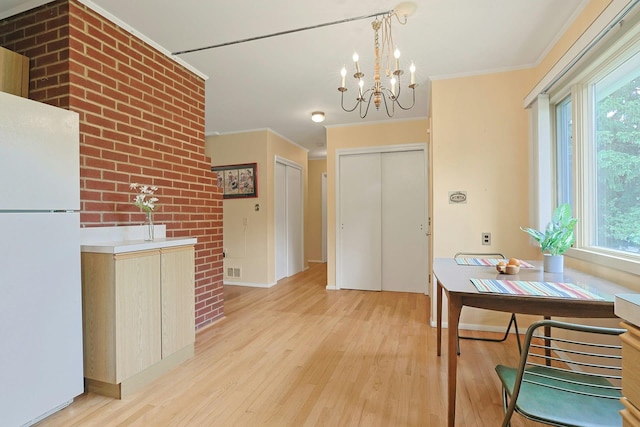 120 Locust Dr, Nyack, NY 10960 - entryway with light wood-style floors, a chandelier, plenty of natural light, crown molding, and baseboards