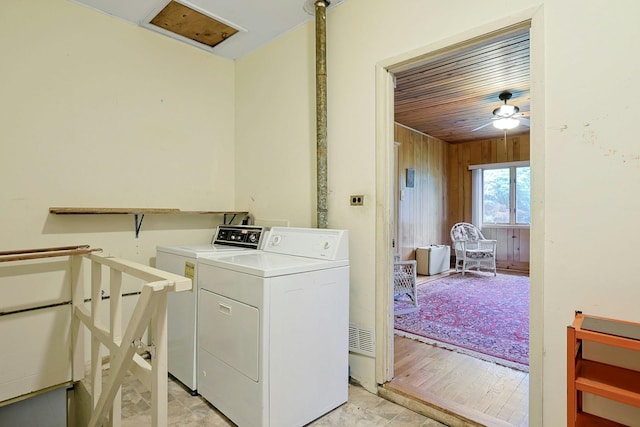 120 Locust Dr, Nyack, NY 10960 - laundry room featuring washing machine and clothes dryer, wood walls, a ceiling fan, wood ceiling, and light wood-type flooring