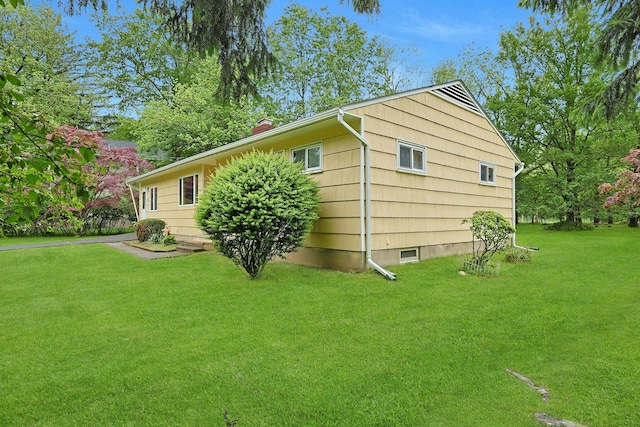 120 Locust Dr, Nyack, NY 10960 - view of home's exterior featuring a lawn and a chimney