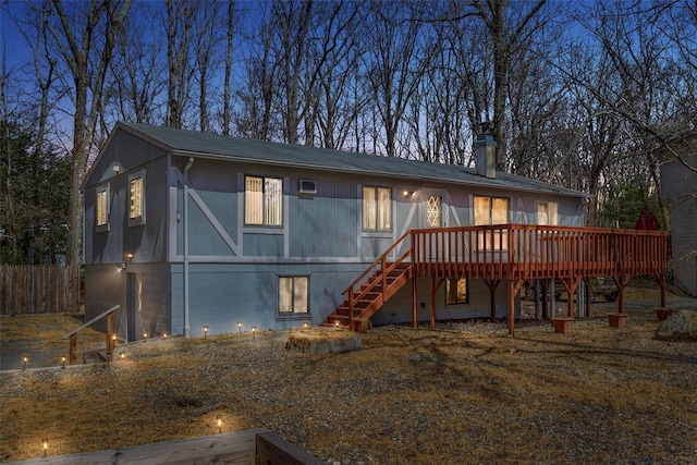 44 Nottingham Gate Rd, Rock Hill, NY 12775 - rear view of property featuring stairs, a deck, and a chimney