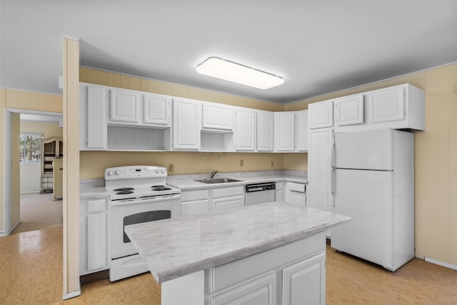 44 Nottingham Gate Rd, Rock Hill, NY 12775 - kitchen with white cabinets, white appliances, light wood-style floors, and a kitchen island
