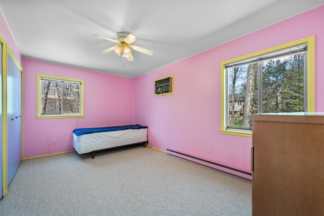 44 Nottingham Gate Rd, Rock Hill, NY 12775 - bedroom featuring carpet, a baseboard heating unit, baseboards, and an AC wall unit