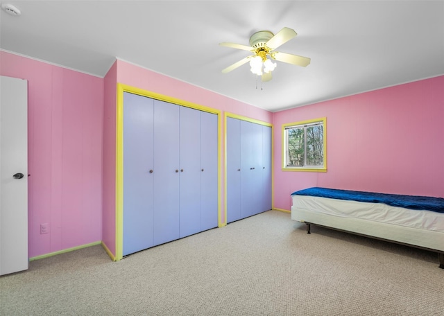 44 Nottingham Gate Rd, Rock Hill, NY 12775 - carpeted bedroom featuring baseboards, two closets, and ceiling fan