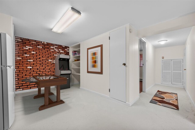 44 Nottingham Gate Rd, Rock Hill, NY 12775 - game room with brick wall, light carpet, built in features, and baseboards