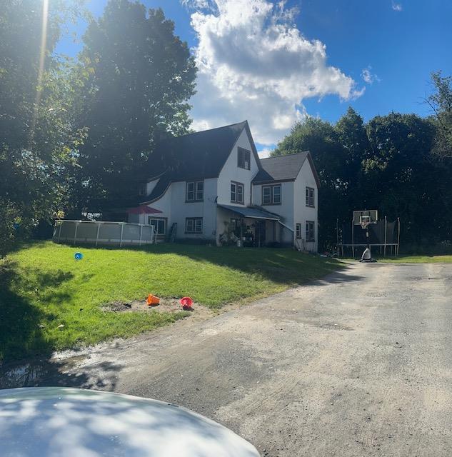 view of front of home with a front lawn