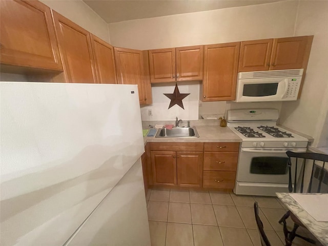 63-61 99th St Unit A4, Rego Park, NY 11374 - kitchen featuring white appliances, light tile patterned floors, light countertops, brown cabinets, and a sink