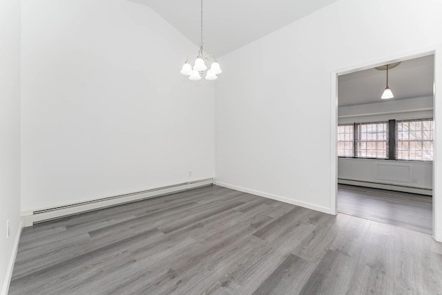 unfurnished dining area featuring a baseboard radiator, vaulted ceiling, a chandelier, and wood finished floors