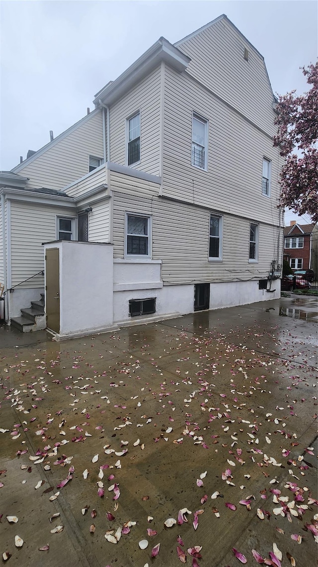 846 215th St E, Bronx, NY 10467 - rear view of house with entry steps