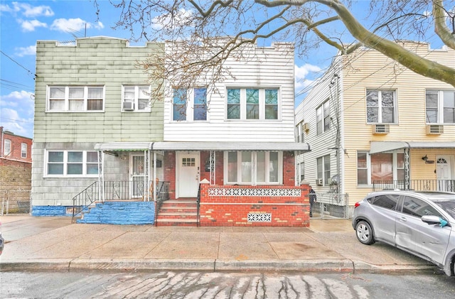 townhome / multi-family property featuring brick siding and crawl space