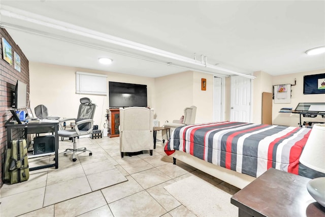 bedroom with light tile patterned floors